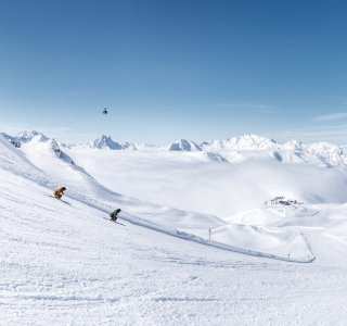 two skier in front of an mesmerising mountain backdrop