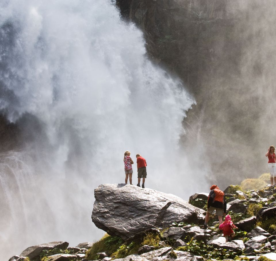 Refreshing spray of the Krimml Waterfalls on the viewing plateau