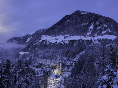 Illuminated Stuibenfall in winter