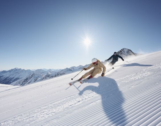 Skiing in the Stubai Valley on the Stubai Valley Glacier on a beautiful sunny day in winter It's best when the sun is shining - a perfect day of skiing on the Stubai Glacier in the Stubai Valley - to be experienced together.