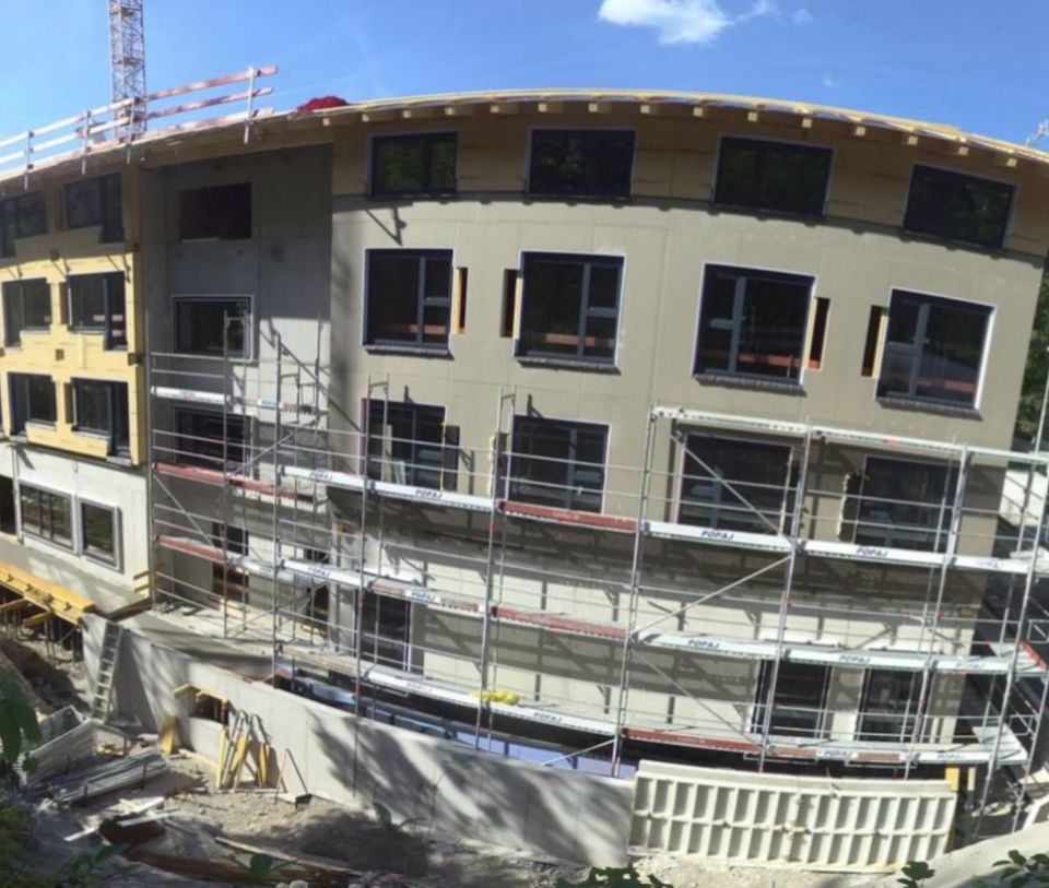 Exterior view of the Explorer Hotel Bayrischzell construction site in June 2026