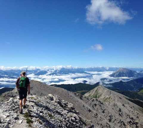 On the ridge above the clouds with a view of the Styrian Ennstal