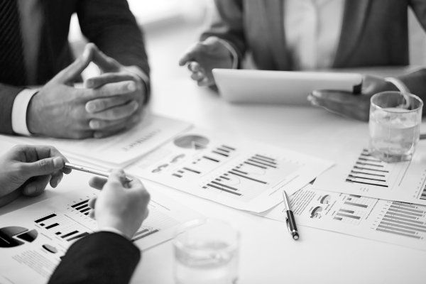 Close-up-businesspeople-working-with-documents-sw