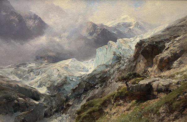 Das Gemälde zeigt den Randbereich des Gepatschferners in einer dramatisch zugespitzten Hochgebirgskomposition. Edward Theodore Compton konzentriert sich auf die unmittelbare Begegnung von Fels und Eis und wählt eine leicht erhöhte Perspektive, die den Blick entlang der zerklüfteten Gletscherfront in die Tiefe des Eisstroms führt.