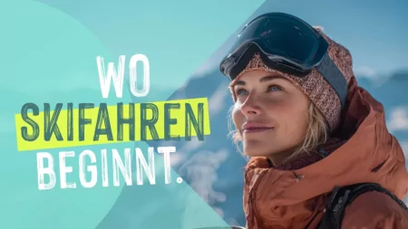 Eine Frau genießt die Aussicht auf die Berge und hält einen Becher. Es ist ein klarer Tag ideal zum Skifahren.