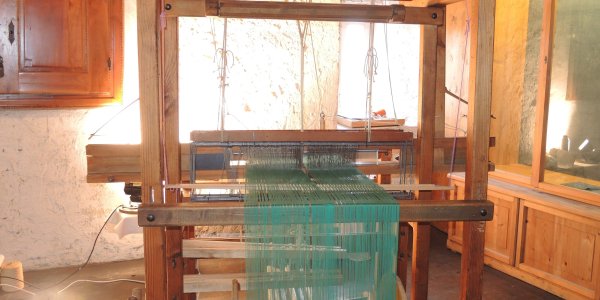 Webstuhl mit grünem Garn im Wassertormuseum