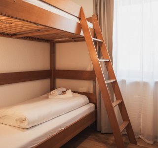 Schlafzimmer mit Stockbett - Family Aparts Gams