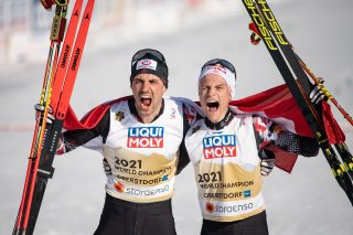 Lukas Greiderer (AUT) and Johannes Lamparter (AUT) celebrate during the Cross Country Men Nordic Combined Team Sprint