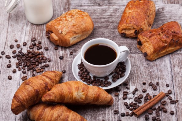 Breakfast-with-fresh-coissants-with-coffe-milk-rustic-wooden-table-golden-croissant