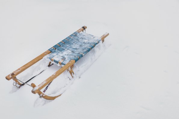 Frozen-wooden-sledge-snowy-land-winter-season b