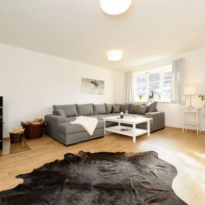 Ferienwohnung Enzian - Wohnzimmer mit Holzofen